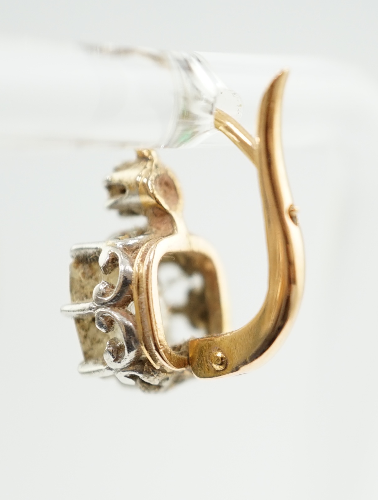 A pair of late 19th/early 20th century gold and two stone cushion cut diamond set earrings